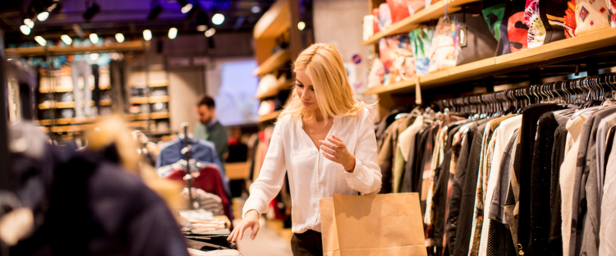 young woman shopping in a clothing store