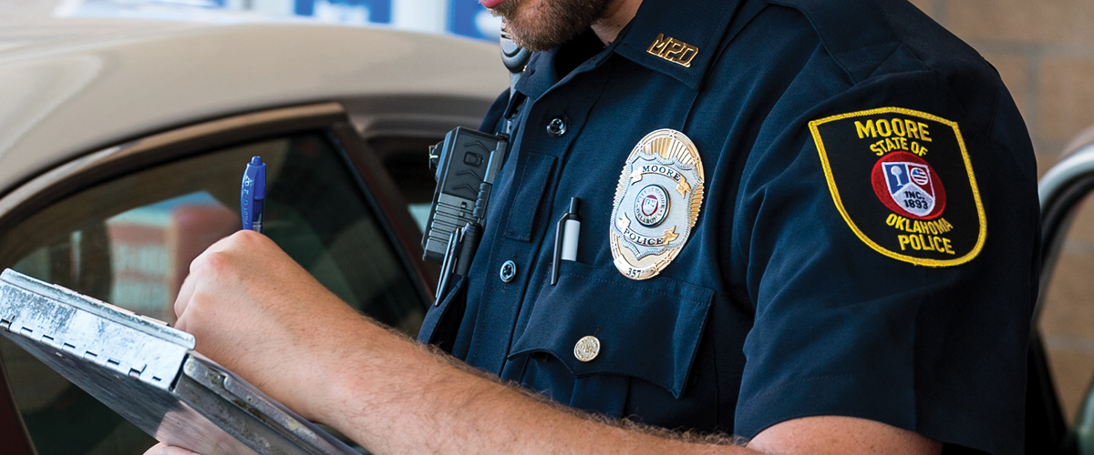 MPD officer writing ticket.