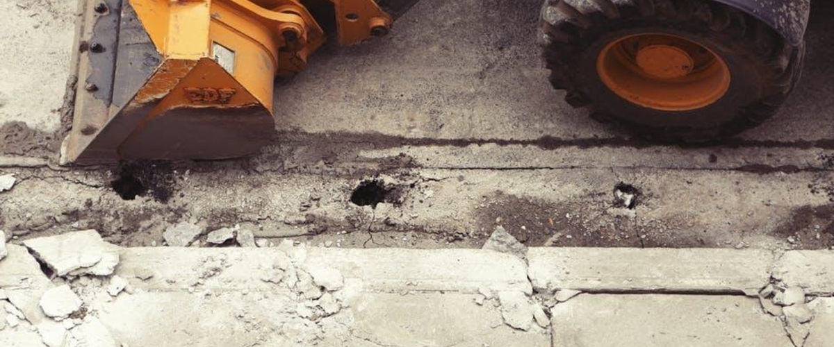 Road Construction Vehicle repairing compromised road