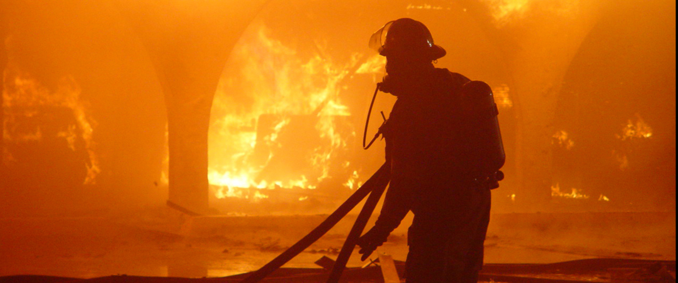Fireman fighting a building fire.
