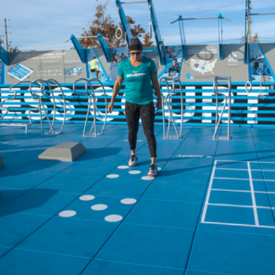 Instructor showing how to use dots on Fitness Court
