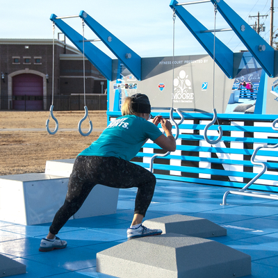 Instructor showing an exercise on Fitness Court